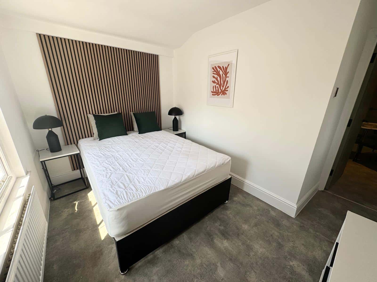refurbished, modern bedroom with wooden wall panels