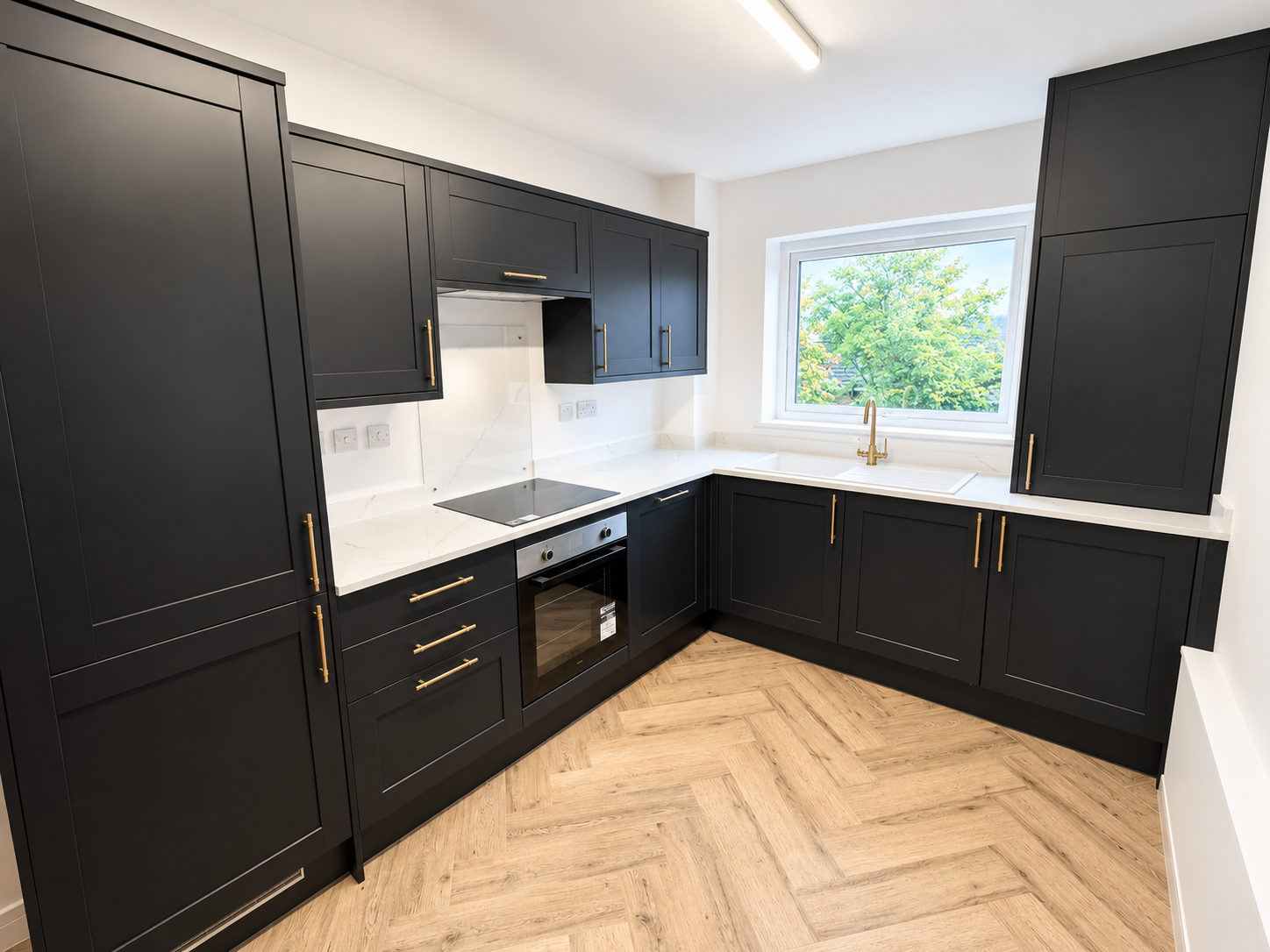 Modern Charcoal and Brass Galley Kitchen
